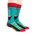 Lifestyle shot of a person wearing a pair of teal Ramen socks with red cuffs and black detailing.
