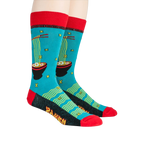 Lifestyle shot of a person wearing a pair of teal Ramen socks with red cuffs and black detailing.