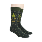 Lifestyle shot: A person's legs wearing the marijuana leaf socks, showcasing the fit and style.