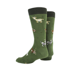 Pair of green crew socks with goat design displayed on a neutral background. This image shows the full sock pattern.