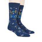 Lifestyle shot showing 'Let It Snow' socks on a person's feet.