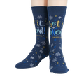 Flat lay showcasing the full design of the 'Let It Snow' socks.