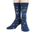 Flat lay showcasing the full design of the 'Let It Snow' socks.