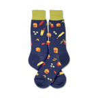 Flatlay image showing a pair of navy blue 'Burger' socks with lime green cuffs.