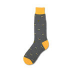 Single charcoal gray crew sock with yellow bees and honeycombs, yellow cuff, shown on white background.