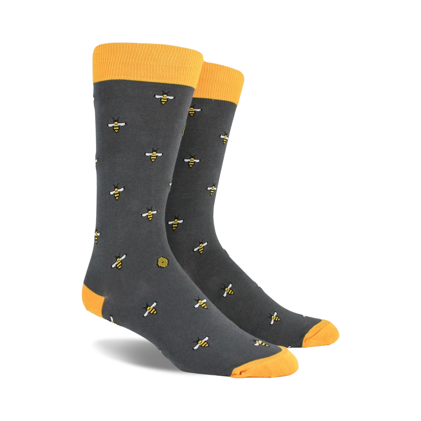A pair of charcoal gray crew socks with a repeating pattern of yellow bees and honeycombs. Yellow tops.