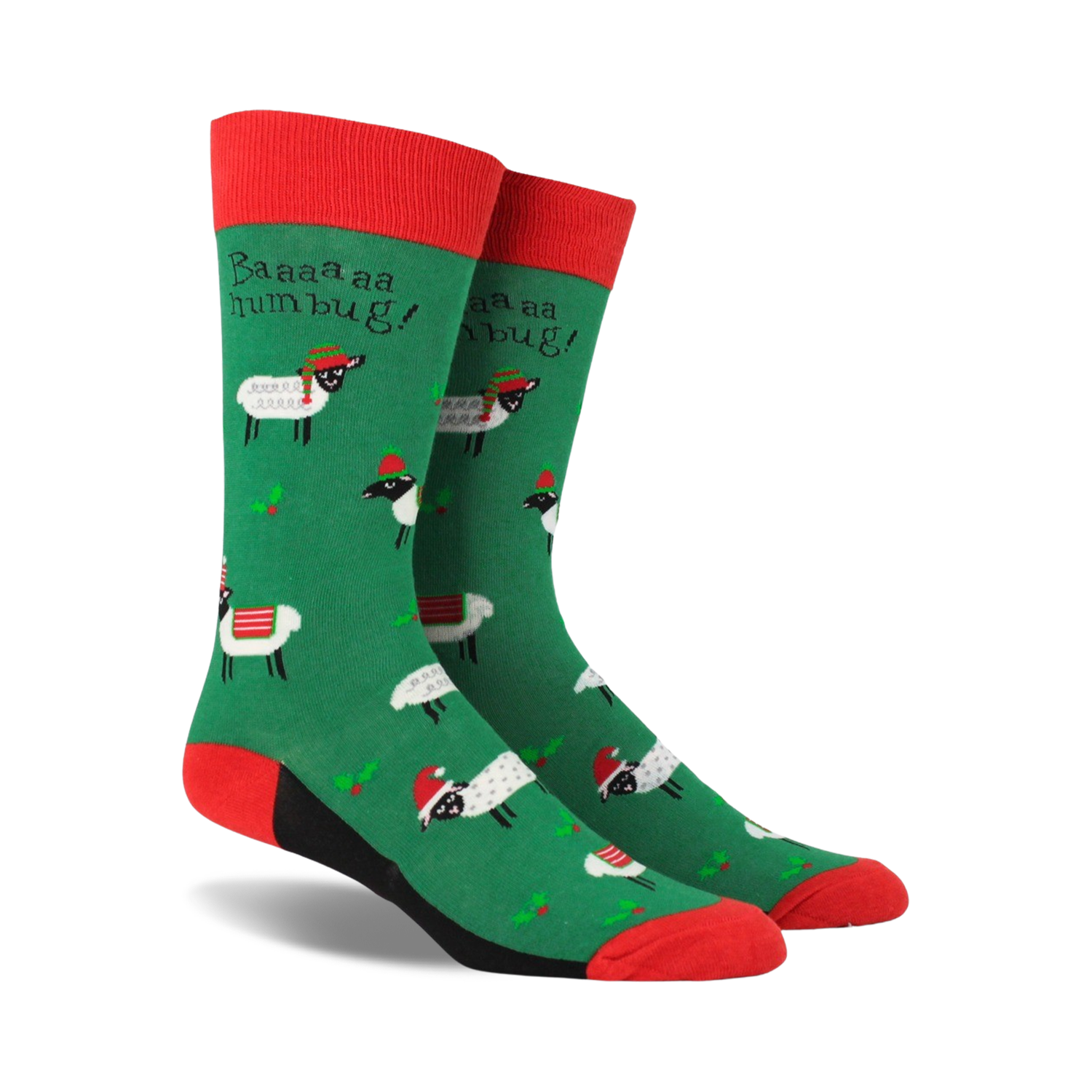 Pair of crew socks; green background with festive sheep wearing Santa hats; red and black accents; 'Baaaa humbug!' text.