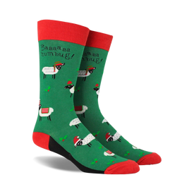 green novelty crew socks with white sheep in red santa hats, red cuffs, black heels, and toes. text: 'baaa...humbug!'  