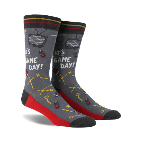 Pair of crew socks in gray, red, and navy blue. Design includes retro TV, game controllers, and the text 'It's Game Day!'