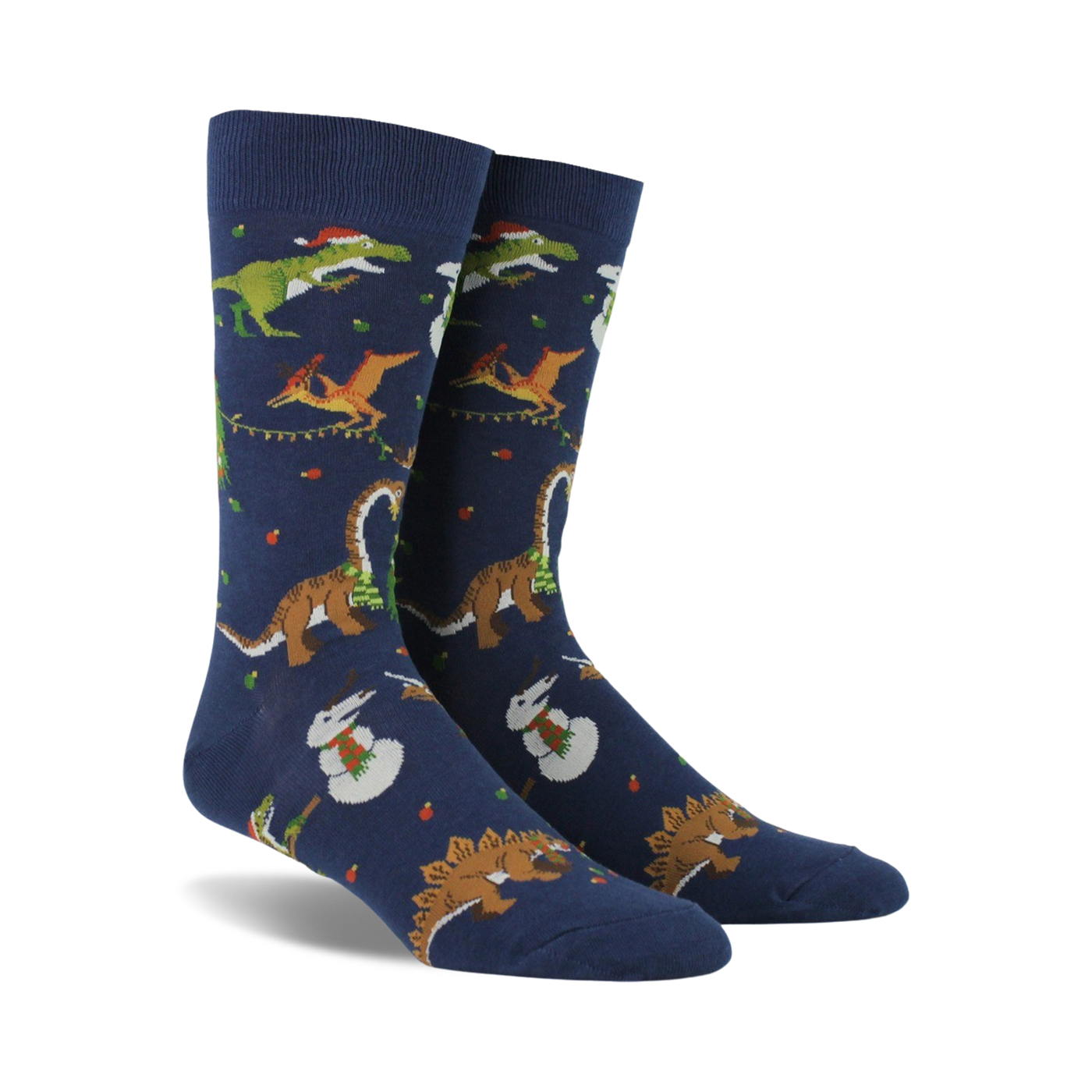Pair of navy blue crew socks. Feature a whimsical Christmas design with dinosaurs decorating trees and snowmen.