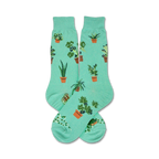 Pair of teal crew socks with illustrated potted plants. Fun, quirky design for plant lovers.