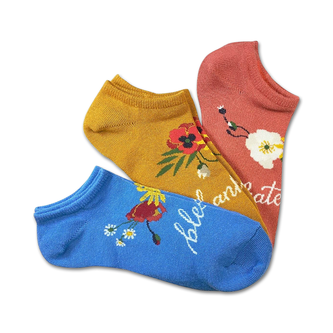 Three low-cut socks in a 3-pack.  Mustard yellow, coral pink, and light blue socks with floral designs and the word 'celebrate'.