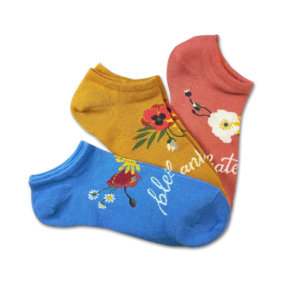 blessings 3 pack of no show socks for women feature inspirational floral patterns in various colors on a yellow, blue, or pink background.   