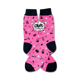 pink crew socks feature black toes and heels, repeating patterns of clothes irons, scissors, measuring tape, and a hanger. "chaos coordinator" displayed on one sock in speech bubble.  