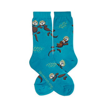 Teal crew socks featuring brown floating sea otters, green kelp, and text reading We need each otter near the toe.