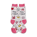A pair of women's crew socks in white with pink accents. They feature colorful bras and the text 'Hang in there!'