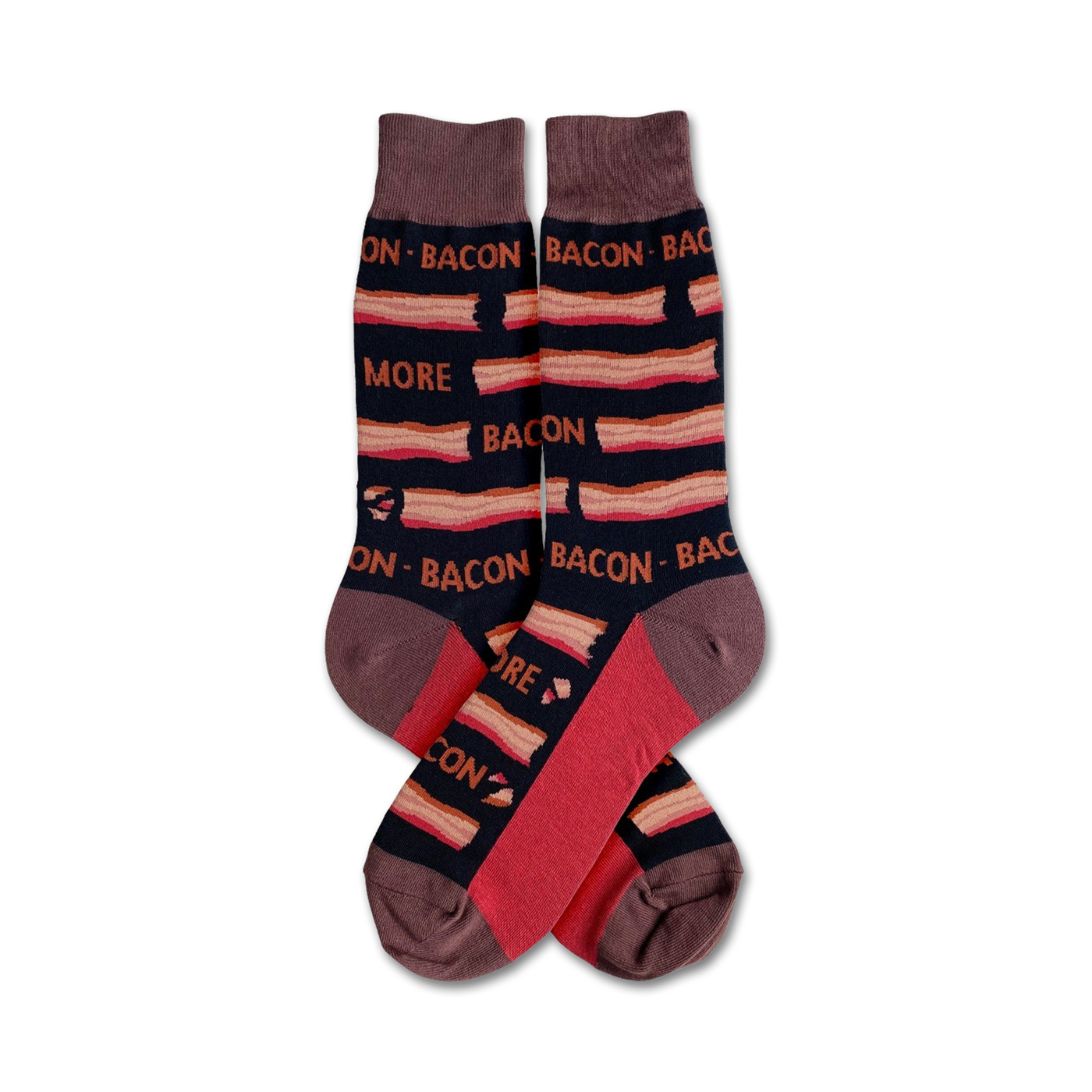 A pair of crew socks with a bacon pattern. The socks are mainly dark brown with red and tan stripes and text that says 'More Bacon'.