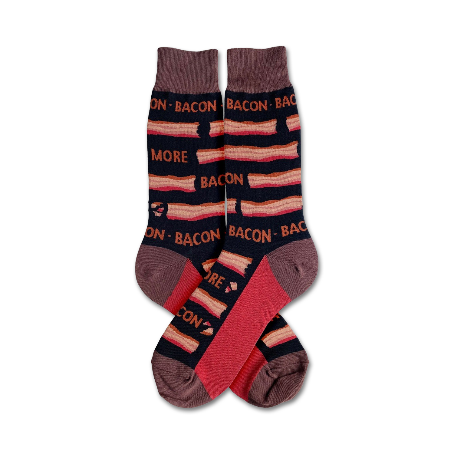A pair of crew socks with a bacon pattern. The socks are mainly dark brown with red and tan stripes and text that says 'More Bacon'.