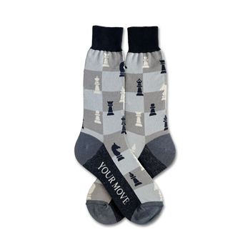 men's crew socks in gray with a black and white checkered pattern and chess pieces. text on bottom of one sock reads: your move.   