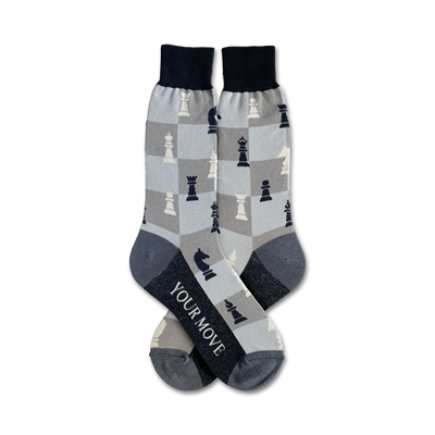 men's crew socks in gray with a black and white checkered pattern and chess pieces. text on bottom of one sock reads: your move.   