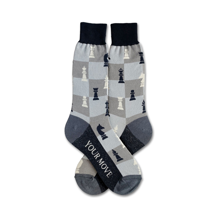 men's crew socks in gray with a black and white checkered pattern and chess pieces. text on bottom of one sock reads: your move.    }}