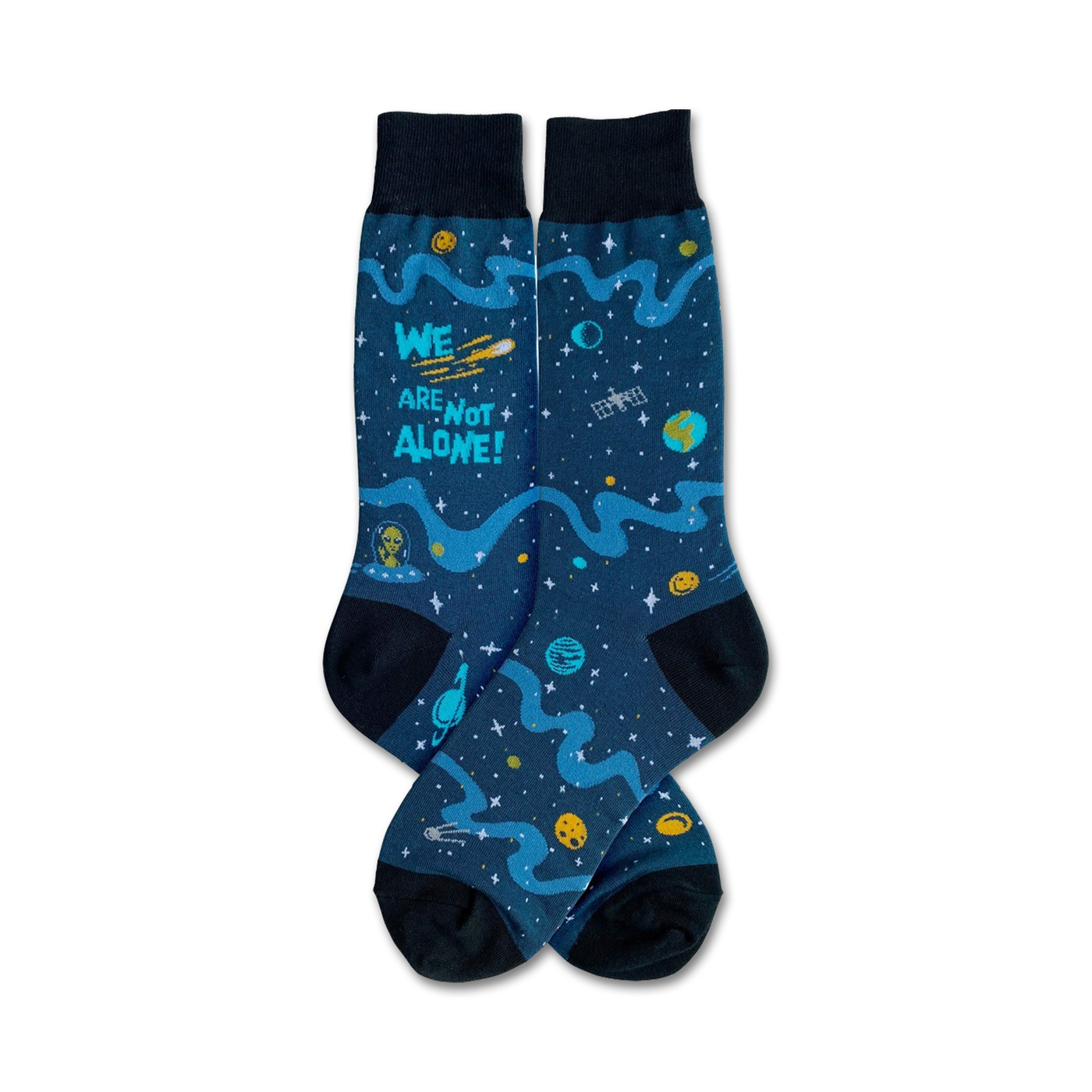 Pair of crew socks in dark blue with teal, yellow, and green designs of planets, stars, an alien, and the text 'We Are Not Alone!'