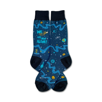 black crew socks featuring "we are not alone" with planets, stars, and aliens.  