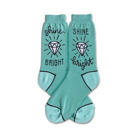 mint green crew socks featuring a diamond and the phrase â€œshine brightâ€ on each pair.  