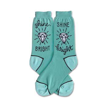 mint green crew socks featuring a diamond and the phrase â€œshine brightâ€ on each pair.  