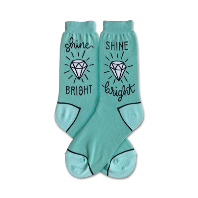 mint green crew socks featuring a diamond and the phrase â€œshine brightâ€ on each pair.  