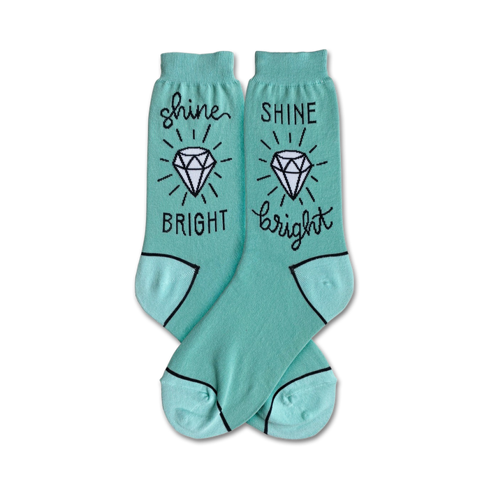 mint green crew socks featuring a diamond and the phrase â€œshine brightâ€ on each pair.   }}