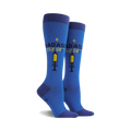 Pair of women's knee-high socks in blue.  The socks feature a graphic of a syringe and the text 'Badass Nurse!' in yellow and black.