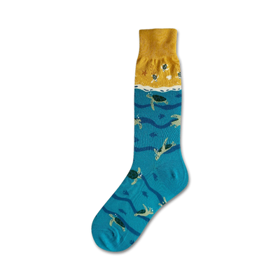 mens crew socks featuring sea turtles swimming in wavy ocean, sandy ocean floor, yellow surface.  