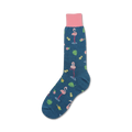 Crew socks in teal featuring pink flamingos, tropical leaves, and yellow flowers. Pink ribbed cuff.