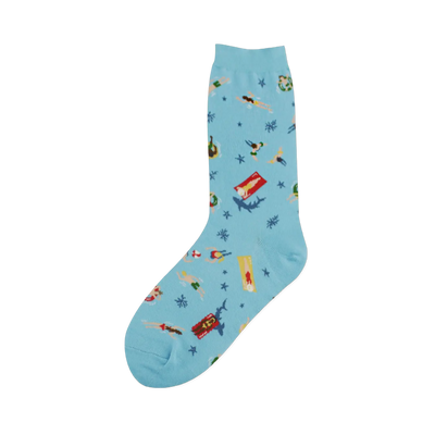 A light blue crew sock features swimmers, sunbathers, sharks, and starfish on a whimsical beach scene.