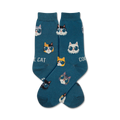 A pair of teal crew socks with a fun pattern of cats wearing sunglasses. The cats are in various colors and styles.