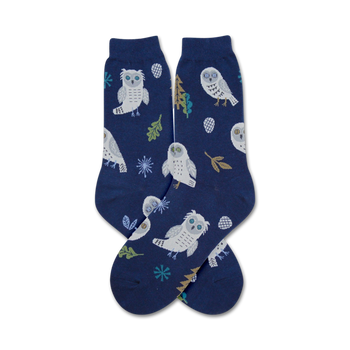 owl themed snowy blue crew socks with white, yellow, brown, and green snowy owl, pine cone, snowflake, and leaf pattern  