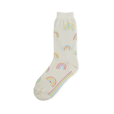 Off-white crew sock covered in small pastel rainbows with tiny hearts underneath, plus colorful stripes on the sole.