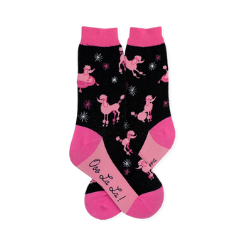 Black crew socks patterned with pink poodles and starbursts, finished with bright pink toes, heels, cuffs, and soles.