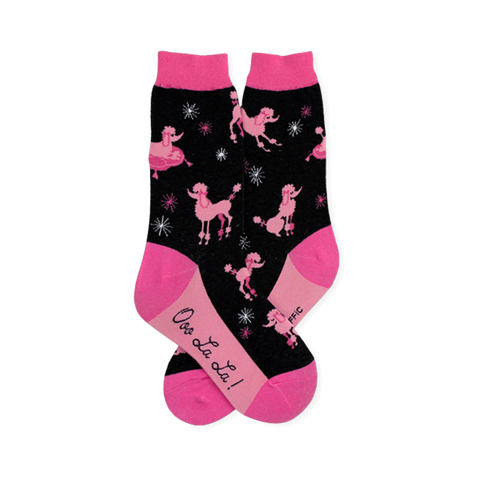 Black crew socks patterned with pink poodles and starbursts, finished with bright pink toes, heels, cuffs, and soles. }}