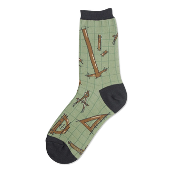 Crew socks in sage green with a repeating pattern of brown architectural tools like rulers, compasses, and set squares on a grid background. Dark gray heel and toe.