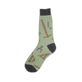 Crew socks in sage green with a pattern of brown architectural tools like rulers, compasses and set squares on a grid background. Dark grey heel and toe.