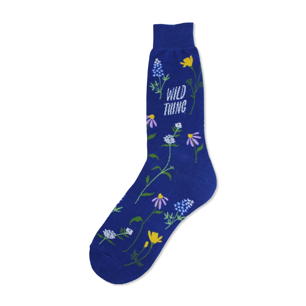 A close-up of a blue crew sock adorned with colorful wildflowers and the text 'Wild Thing'.