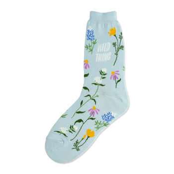 Light blue crew socks adorned with a whimsical pattern of various wildflowers in pink, purple, yellow, and blue, along with the text 'Wild Thing'.