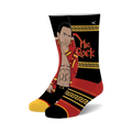 The Great One crew socks. Black, red, and gold design featuring The Rock's illustration and a Greek key pattern.