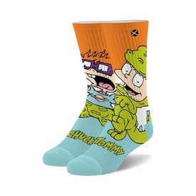 light blue crew socks with orange cuff feature repeating pattern of tommy and chuckie from rugrats.   