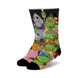 teenage mutant ninja turtle crew socks for men & women feature colorful cartoon character design in a black style with green cuffs & toes.  