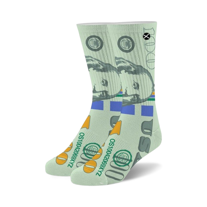 white, green, and blue unisex crew socks featuring a repeating pattern of $100 bills.  