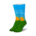 Pair of blue crew socks with green hills, an orange rising sun, and "I'M A RAY OF FUCKING SUNSHINE" text.