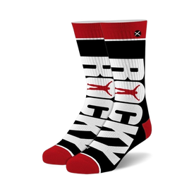 black crew socks with red toe and heel, featuring white rocky lettering. perfect for rocky fans.